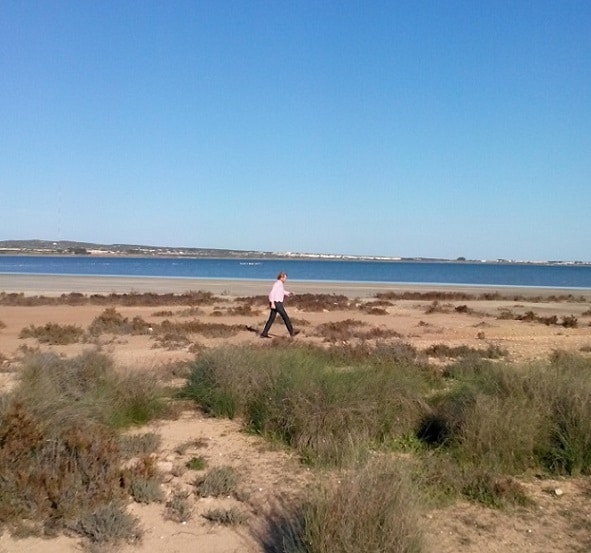 Me walking along the bank of the lake