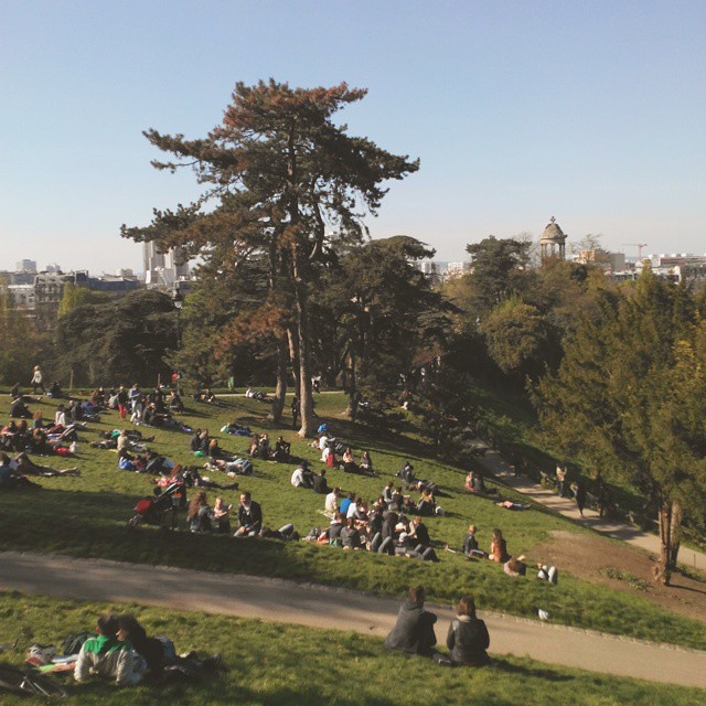 People seating on lawns on a May afternoon