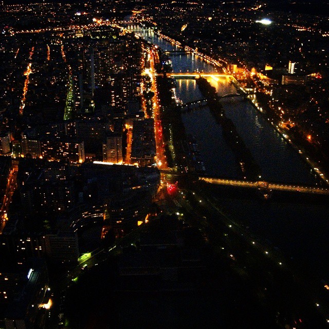 A vew from the Eiffel Tower at night